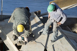 Workers cutting concrete