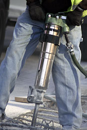 Man using a large concrete drill